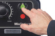 Hamilton Beach HMD1000 MixStation manual drink mixer, finger pressing the green start button on the control panel