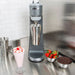 Hamilton Beach HMD200 series single-spindle drink mixer on a stainless counter beside a milkshake and berries