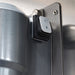 Hamilton Beach HMD300 wall-mounted drink mixer, side close-up of the switch and wall mounting plate screws