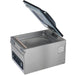 Hamilton Beach HVC305 chamber vacuum sealing machine with clear lid open showing the empty stainless chamber