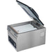 Hamilton Beach HVC305 chamber vacuum sealer with lid open and a white filler plate inside the chamber, angled