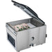 Hamilton Beach HVC406 chamber vacuum sealer with lid open and vacuum-packed chicken inside the chamber
