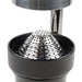 Hamilton Beach model 932 manual juicer, close-up of the perforated stainless steel strainer cone in the black cup