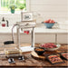 LEM 1432 manual 2 in 1 slicer and tenderizer clamped to a kitchen counter with sliced jerky strips and meat