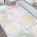 Nordic Air IDF-47 ice cream dipping freezer, close-up of tub wells filled with assorted ice cream flavours
