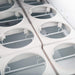 Nordic Air IDF-68 ice cream dipping freezer, close-up of the empty white tub wells with round openings