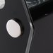 Nordic Air NCCP-28 countertop pastry display case, close-up of the round chrome button on the black side panel