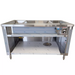 Phoenix CST-4 stainless steel 4 well steam table without sneeze guard, front view of the open base