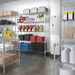 Phoenix chrome wire shelf kits in a commercial kitchen storage room stocked with dry goods, bins and containers