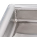 Phoenix clean dish table, close-up of the welded stainless steel corner and raised rolled rim