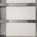 Phoenix heavy duty butcher table, close-up of the stainless steel frame rails supporting the white cutting board panels