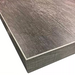 Phoenix high quality table top in a darker brown-grey distressed wood grain finish, close-up of the corner and edge