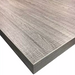 Phoenix high quality table top in a lighter grey distressed wood grain finish, close-up of the corner and edge