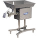 Pro-Cut KG-32-XP size 32 meat grinder in stainless steel with large 38 x 25 inch feeding pan on a tall stand, angled