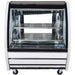 Pro-Kold DDC-40 curved glass refrigerated deli case, straight front view showing lit interior and two wire shelves