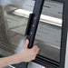 Pro-Kold DDC-60 refrigerated deli case, close-up of a hand sliding the rear glass door by its black handle