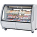 Pro-Kold DDC-60 curved glass 56 inch refrigerated deli case in white finish, shown stocked with meats and cheeses