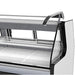 Pro-Kold MCRU-100-WL refrigerated fresh meat display case, close-up of the curved front glass and interior shelf