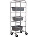 Winco ABBC-6 aluminum 6 tier bus bin rack shown holding three grey bus bins on its slides, mobile on casters