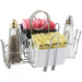 Winco chrome plated cruet rack with salt and pepper shakers and a white caddy of sugar packets in the centre
