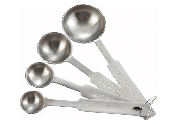Winco deluxe stainless steel measuring spoon set of 4 with round bowls, fanned out on a ring