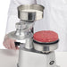 Winco KATTEX HBP-3 heavy-duty burger patty press shown with a finished pressed beef patty in the stainless mould