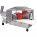 Magnum straight blade tomato slicer with pusher handle raised and tomatoes in the blade assembly, side angled view