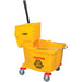 Winco yellow mop bucket with side-press wringer, caution graphic, red casters and black handle, angled view