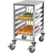 Winco SRK-12 stainless steel 12-tier food pan rack shown loaded with pans of fresh vegetables and fruit