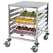 Winco SRK-12D 12-tier stainless steel food pan rack shown loaded with pans of fresh fruit and vegetables