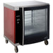 Alto-Shaam AR-7H electric chicken rotisserie holding cabinet with red side panels, glass door and caster base